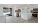 Modern kitchen with white cabinetry, stainless steel appliances, and access to a pool at 407 E Orion St, Tempe, AZ 85283