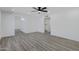 Bright living room with modern gray wood flooring and ceiling fan at 407 E Orion St, Tempe, AZ 85283