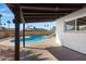Covered patio offers a relaxing view of the pool and palm trees at 407 E Orion St, Tempe, AZ 85283
