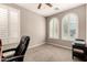 Bright office space with large windows offering ample natural light and neutral carpeting at 41342 W Elm Dr, Maricopa, AZ 85138