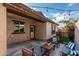 Inviting backyard patio with comfortable seating and ambient string lights for outdoor enjoyment at 4273 S Red Rock St, Gilbert, AZ 85297