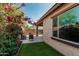 Private backyard features a cozy patio and vibrant flowers, creating a tranquil retreat at 4273 S Red Rock St, Gilbert, AZ 85297