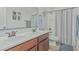 Bathroom featuring double sinks, a toilet and a shower with striped curtain at 4273 S Red Rock St, Gilbert, AZ 85297