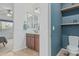 Cozy bathroom showcasing a vanity and toilet nook with a rustic, charming aesthetic at 4273 S Red Rock St, Gilbert, AZ 85297