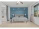 Comfortable bedroom featuring a navy accent wall, and a large window with natural light at 4273 S Red Rock St, Gilbert, AZ 85297