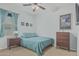 Comfortable bedroom featuring a ceiling fan, window and a picture on the wall at 4273 S Red Rock St, Gilbert, AZ 85297