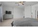 Bright bedroom featuring a comfortable bed, gray dresser, and a view to an ensuite bath at 4273 S Red Rock St, Gilbert, AZ 85297