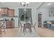 Cozy dining area with a round table, gray chairs, pendant lighting, and bright natural light at 4273 S Red Rock St, Gilbert, AZ 85297