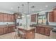Spacious kitchen featuring granite countertops, stainless steel appliances, and a convenient center island at 4273 S Red Rock St, Gilbert, AZ 85297