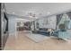 Open-concept living room with a cozy couch, tile floors and plenty of natural light at 4273 S Red Rock St, Gilbert, AZ 85297