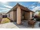 Covered patio with seating area and view of well-maintained backyard, ideal for outdoor living at 4273 S Red Rock St, Gilbert, AZ 85297