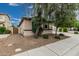 Charming single-story home featuring a well-manicured lawn and privacy fencing at 4273 S Red Rock St, Gilbert, AZ 85297