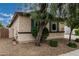 Charming single-story home featuring a well-manicured lawn and privacy fencing at 4273 S Red Rock St, Gilbert, AZ 85297