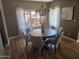 Dining room with an ornate chandelier, round table, and views to the outside at 514 W Monte Vista Rd, Phoenix, AZ 85003