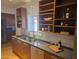 Contemporary kitchen showcasing wooden cabinets, a stainless sink, and modern white tile at 514 W Monte Vista Rd, Phoenix, AZ 85003