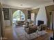 Inviting living room with a striking fireplace, large arched window, and built-in shelving at 514 W Monte Vista Rd, Phoenix, AZ 85003