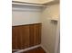 Inside a functional closet with a wooden wall panel, rod, and shelf, providing ample storage at 5212 N 42Nd Ln, Phoenix, AZ 85019