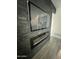 Living room featuring a modern fireplace and mounted TV with black slate surround at 5212 N 42Nd Ln, Phoenix, AZ 85019