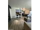 Open-concept living area showcases modern finishes, a cozy fireplace, and bar seating at 5212 N 42Nd Ln, Phoenix, AZ 85019