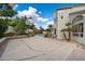 Large backyard featuring a basketball court, inground pool, and mature landscaping at 5402 E Helena Dr, Scottsdale, AZ 85254
