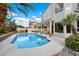 Beautiful backyard featuring a large inground pool, covered patio, and lush landscaping at 5402 E Helena Dr, Scottsdale, AZ 85254