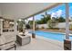 Relaxing backyard featuring a fire pit, inground pool, and comfortable seating area at 5402 E Helena Dr, Scottsdale, AZ 85254