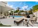 Resort-style backyard featuring a built-in grill, inground pool, and comfortable seating at 5402 E Helena Dr, Scottsdale, AZ 85254