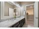 Bright bathroom featuring a double sink vanity with marble counters and modern fixtures at 5402 E Helena Dr, Scottsdale, AZ 85254