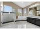 Luxurious primary bathroom with a walk-in shower and a soaking tub at 5402 E Helena Dr, Scottsdale, AZ 85254