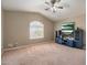 Spacious bedroom with plush carpeting, ceiling fan, and entertainment center at 5402 E Helena Dr, Scottsdale, AZ 85254