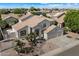 Stylish single-Gathering home featuring a three-car garage and desert landscaping at 5402 E Helena Dr, Scottsdale, AZ 85254