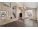 Inviting foyer with high ceilings, travertine tile flooring, and a staircase, offering a grand entrance and an open layout at 5402 E Helena Dr, Scottsdale, AZ 85254
