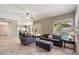 Inviting living room with tiled floors, comfortable seating, and a view of the outdoor pool at 5402 E Helena Dr, Scottsdale, AZ 85254