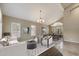 Neutral living room featuring vaulted ceilings, plantation shutters, and elegant furnishings, creating a cozy and stylish atmosphere at 5402 E Helena Dr, Scottsdale, AZ 85254