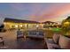 Expansive backyard with a well-manicured lawn, comfortable seating, and a refreshing pool, ideal for outdoor living at 5424 N 186Th Dr, Litchfield Park, AZ 85340