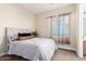 Comfortable bedroom with decorative pillows and great natural light at 5424 N 186Th Dr, Litchfield Park, AZ 85340