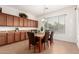 The dining room features a stone table with wood legs, cabinets along the wall, and natural light at 5424 N 186Th Dr, Litchfield Park, AZ 85340