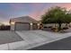 Charming single-story home featuring a well-manicured lawn and a three-car garage, providing ample space at 5424 N 186Th Dr, Litchfield Park, AZ 85340
