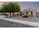 Charming single-story home with mature tree and well-kept gravel landscaping at 5424 N 186Th Dr, Litchfield Park, AZ 85340