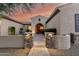Charming front entrance with a brick pathway, stone pillars, and a well-maintained courtyard, creating curb appeal at 5424 N 186Th Dr, Litchfield Park, AZ 85340
