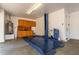 Spacious garage featuring a car lift, ample storage, and a utility sink, perfect for car enthusiasts at 5424 N 186Th Dr, Litchfield Park, AZ 85340