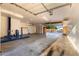 Spacious garage featuring a car lift and ample storage, offering plenty of room for vehicles and equipment at 5424 N 186Th Dr, Litchfield Park, AZ 85340