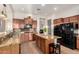Kitchen with granite counters, stainless appliances, a breakfast bar, and a center island at 5424 N 186Th Dr, Litchfield Park, AZ 85340