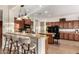 Beautiful kitchen featuring granite countertops, stainless steel appliances, and a breakfast bar with seating at 5424 N 186Th Dr, Litchfield Park, AZ 85340