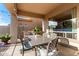 Covered patio featuring an outdoor kitchen, BBQ, dining table and chairs at 5424 N 186Th Dr, Litchfield Park, AZ 85340