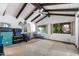 Spacious bedroom features vaulted ceilings, exposed beams, lots of natural light, and neutral carpeting at 5536 N Camelback Canyon Pl, Phoenix, AZ 85018