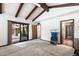 Large bedroom featuring vaulted ceiling, neutral carpet, access to the backyard, and lots of natural light at 5536 N Camelback Canyon Pl, Phoenix, AZ 85018
