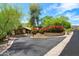 Well maintained home with lush landscaping and a circular driveway on a sunny day at 5536 N Camelback Canyon Pl, Phoenix, AZ 85018