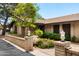 Charming home featuring brick accents, desert landscaping, and mature trees at 5536 N Camelback Canyon Pl, Phoenix, AZ 85018