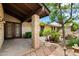 Inviting home entrance with stone walkway, desert landscaping, and a custom front door at 5536 N Camelback Canyon Pl, Phoenix, AZ 85018